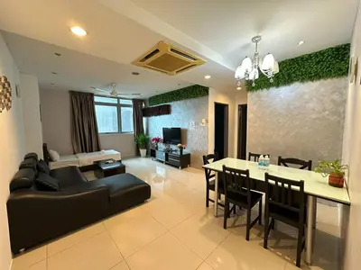 a living room with a couch and a dining room at Taragon Homestay - Kuala Lumpur, Malaysia in Kuala Lumpur
