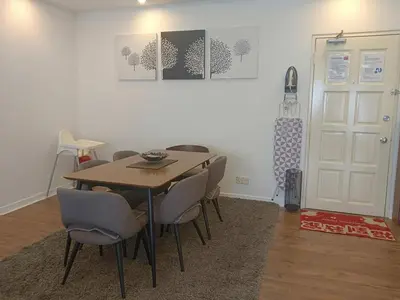 a dining room with a table and some chairs at Fahrenheit 88 Suites Bukit Bintang H 3R in Kuala Lumpur