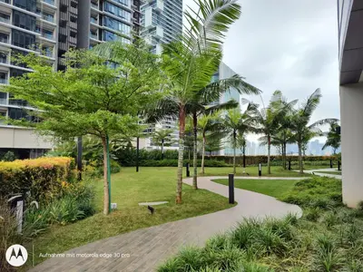 a park with palm trees and a walkway at Eaton suites KLCC at KL in Kuala Lumpur