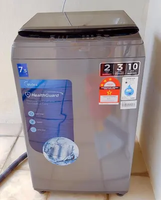 a cooler is sitting on the floor with stickers on it at AJ-HOME Fahrenheit 88 Pavillion Bukit Bintang 8pax in Kuala Lumpur