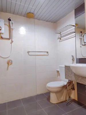 a bathroom with a shower and a toilet and a sink at AJ-HOME Fahrenheit 88 Pavillion Bukit Bintang 8pax in Kuala Lumpur