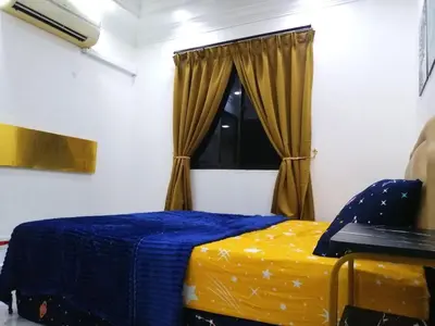 a bedroom with a bed and a window at Apartment Low Cost 2 Bilik Asnor Homestay KL in Kuala Lumpur