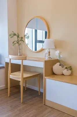 a dressing table with a mirror and a desk with a lamp at KLCC SkyTowerViewSuite AT CeylonzSuites in Kuala Lumpur