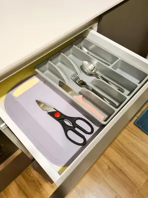 a drawer with scissors and other utensils in it at Romantic Log Cabin - walk to KL Tower, KLCC, Bukit Bintang in Kuala Lumpur