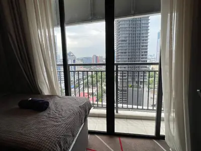 a bedroom with a bed and a large window at ComfyHomes M101 Dang Wangi Pool KLCC View in Kuala Lumpur