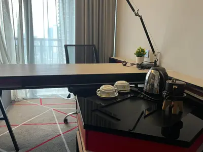 a desk with a lamp on top of it in a room at ComfyHomes M101 Dang Wangi Pool KLCC View in Kuala Lumpur