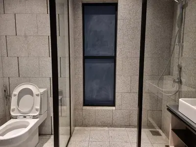 a bathroom with a toilet and a sink at Scarletz Suites KLCC by De Harlequins Guesthouse in Kuala Lumpur