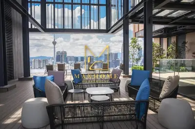 a patio with furniture and a view of a city at Maxhome Plus at Lucentia Bukit Bintang City centre KL in Kuala Lumpur