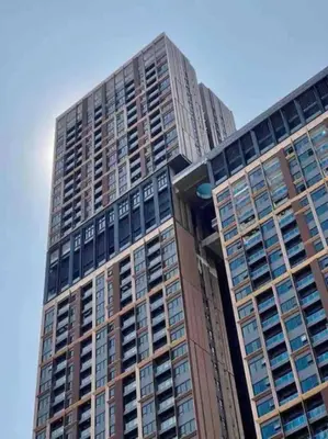 a tall building with many windows on top of it at Maxhome Plus at Lucentia Bukit Bintang City centre KL in Kuala Lumpur