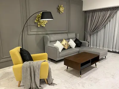 a living room with a couch and a coffee table at Eaton Residences KLCC by WSD in Kuala Lumpur