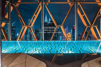 a swimming pool with a city skyline in the background at Scarletz Suites by Edenzpace @ KLCC Area in Kuala Lumpur