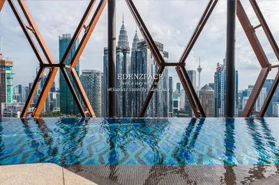 a swimming pool with a view of the city at Scarletz Suites by Edenzpace @ KLCC Area in Kuala Lumpur