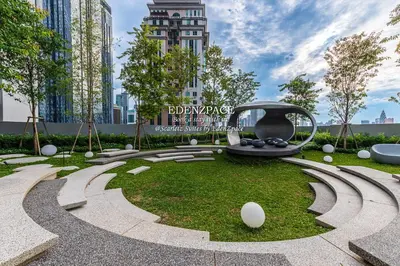 a park in a city with a swing at Scarletz Suites by Edenzpace @ KLCC Area in Kuala Lumpur