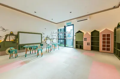 a room with two tables and chairs in it at Scarletz Suites by Edenzpace @ KLCC Area in Kuala Lumpur