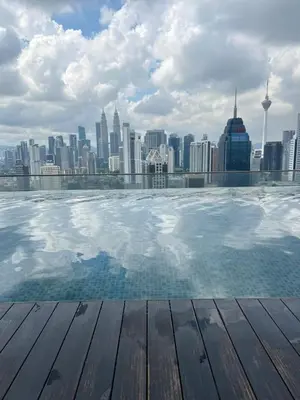 a view of a city skyline from a swimming pool at Regalia Modern Studio in Kuala Lumpur