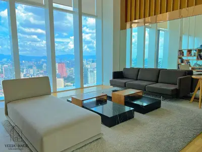 a living room with a couch and a table at The Platinum KLCC by Veedu Hauz in Kuala Lumpur