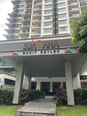 a building with a sign in front of a building at The Wisdom Apartment in Kuala Lumpur