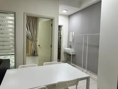 a bathroom with a white table and chairs and a shower at Diamond Home Comfort @ Arte Mont Kiara in Kuala Lumpur