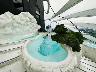 a swimming pool on the top of a building at Diamond Home Comfort @ Arte Mont Kiara in Kuala Lumpur