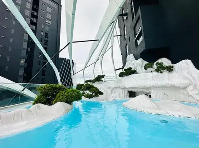 a swimming pool with ice formations in a city at Diamond Home Comfort @ Arte Mont Kiara in Kuala Lumpur