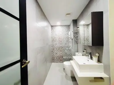 a bathroom with a white toilet and a sink at ARTE Mont Kiara Host By HOST CORNER SUITES in Kuala Lumpur