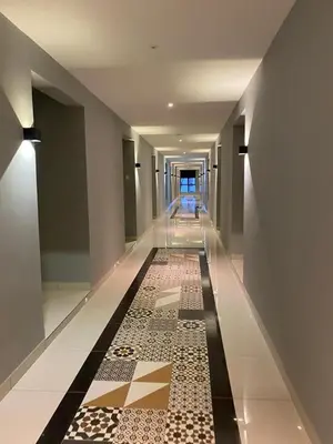 a hallway with a tile floor in a building at ARTE Mont Kiara Host By HOST CORNER SUITES in Kuala Lumpur