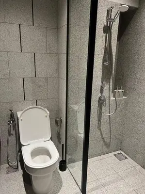 a bathroom with a toilet and a shower stall at Luxury Scarletz Suite KLCC in Kuala Lumpur