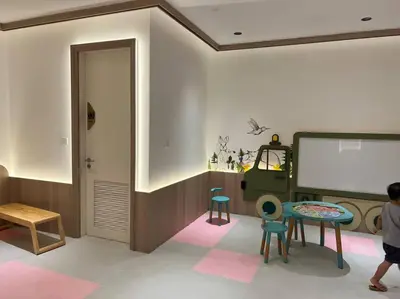 a room with a table and chairs and a projection screen at Luxury Scarletz Suite KLCC in Kuala Lumpur