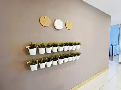 a wall with a bunch of potted plants on it at [PROMO]Connected train 2 Bedroom (ABOVE MALL)15 in Kuala Lumpur