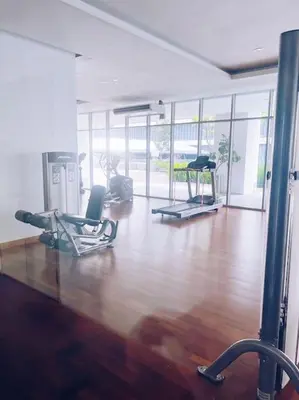 a gym with two chairs and a hard wood floor at [PROMO]Connected train 2 Bedroom (ABOVE MALL)15 in Kuala Lumpur