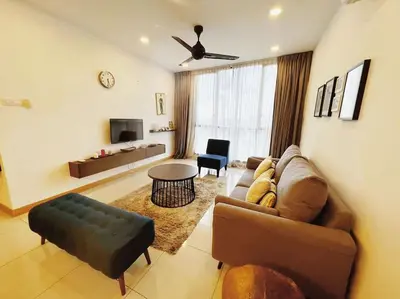 a living room with a couch and a table at [PROMO]Connected train 2 Bedroom (ABOVE MALL)15 in Kuala Lumpur