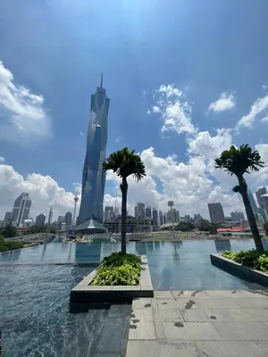 a view of a city with palm trees in the water at Opus Residences KL 118 View in Kuala Lumpur