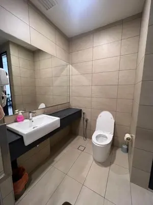 a bathroom with a toilet and a sink at Opus Residences KL 118 View in Kuala Lumpur