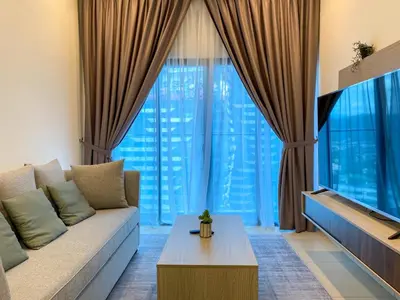 a living room with a couch and a large window at Skyline Garden 2 Bedrooms Homestay Near KLCC in Kuala Lumpur
