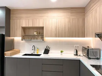 a kitchen with a sink and a microwave at Skyline Garden 2 Bedrooms Homestay Near KLCC in Kuala Lumpur