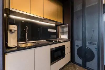 a kitchen with a sink and a counter top at KLCC ModernMusicalSuite AT ScarletzSuites in Kuala Lumpur