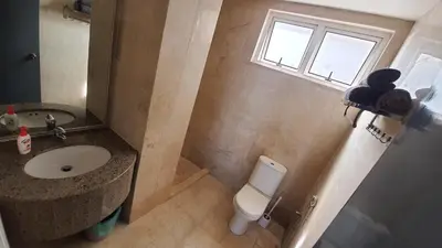 a bathroom with a sink and a toilet and a window at Homestay Jalan Tun Razak walking distance IJN, HKL, MRT Raja Uda, PUSRAWI, KPJ, PERKESO, Istana Budaya Гостевой дом Куала-Лумпур โฮมสเตย์ กัวลาลัมเปอร์ in Kuala Lumpur