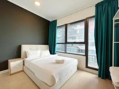 a bedroom with a bed and a large window at Arte plus by Sweet home in Kuala Lumpur