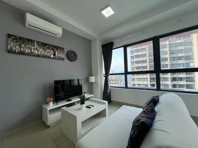 a living room with a couch and a tv at Arte plus by Sweet home in Kuala Lumpur