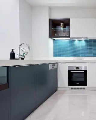a white kitchen with a sink and a dishwasher at Tropicana The Residence suites by VV Homestay KLCC in Kuala Lumpur