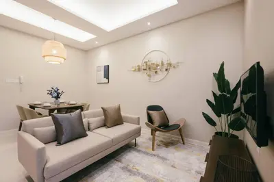 a living room with a couch and a table at Dorsett Residences Hartamas Kuala Lumpur by Feel Home in Kuala Lumpur