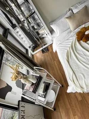 a bedroom with a bed and a table with a book at INS Style 5PAX 2R2B Sunway Velocity Linked in Kuala Lumpur