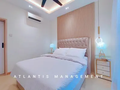 a bedroom with a white bed and a night stand at Arte Mont Kiara, Private Elegant Suite manage by Atlantis Management in Kuala Lumpur