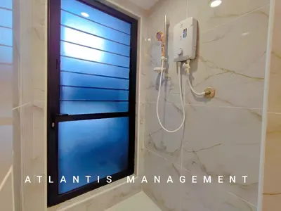 a shower in a bathroom with a window at Arte Mont Kiara, Private Elegant Suite manage by Atlantis Management in Kuala Lumpur