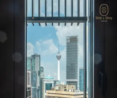 a view of the seattle skyline from a window at AXQUISITE SUITES at KLCC in Kuala Lumpur