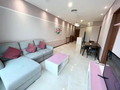 a living room with a couch and a table at Sky Suites KLCC by PNUT in Kuala Lumpur