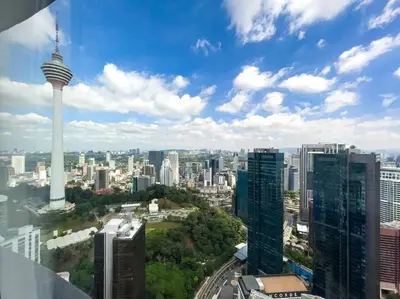 a view of a city with the space needle at The Luxury Penthouses KLCC Petronas Twin tower Kuala Lumpur in Kuala Lumpur