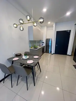 a kitchen and dining room with a table and chairs at Opus Residences KL Malaysia in Kuala Lumpur
