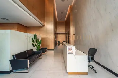 a lobby with a waiting room with a couch and chairs at The Colony and The Luxe Premier Suites Kuala Lumpur in Kuala Lumpur