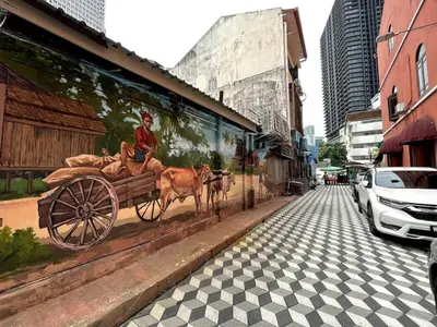 a mural on the side of a building with a horse drawn carriage at #16 M101 Dang Wangi KLCC View Pool By Livin in Kuala Lumpur